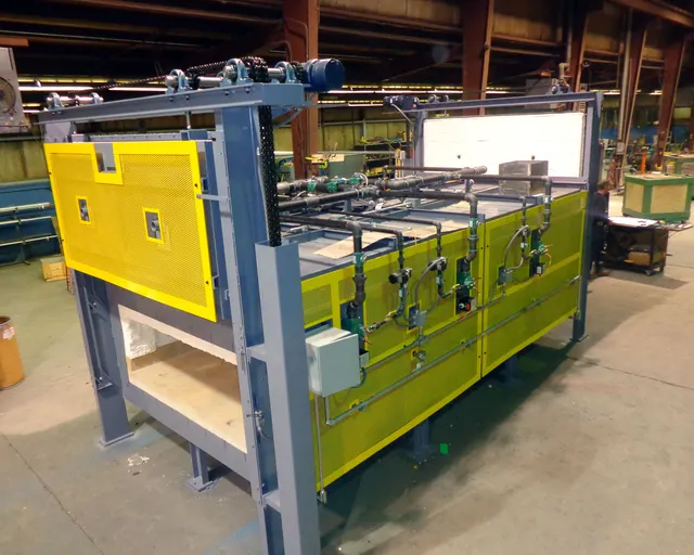 Upton box furnace with a yellow door and side panels on the shop floor